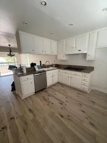 a kitchen with a sink and cabinets
