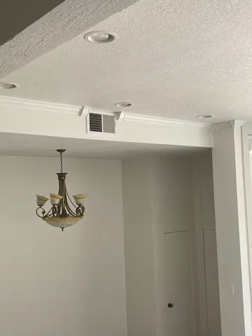 a view of a room with wooden floor and staircase