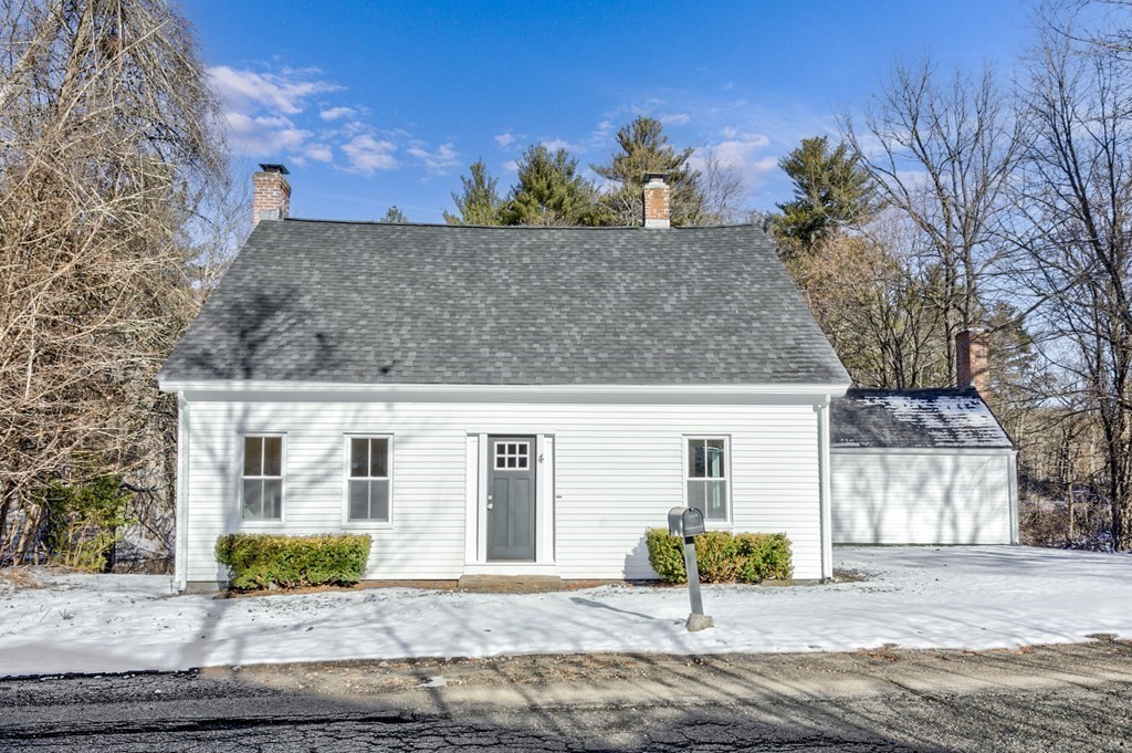 front view of a house with a bench