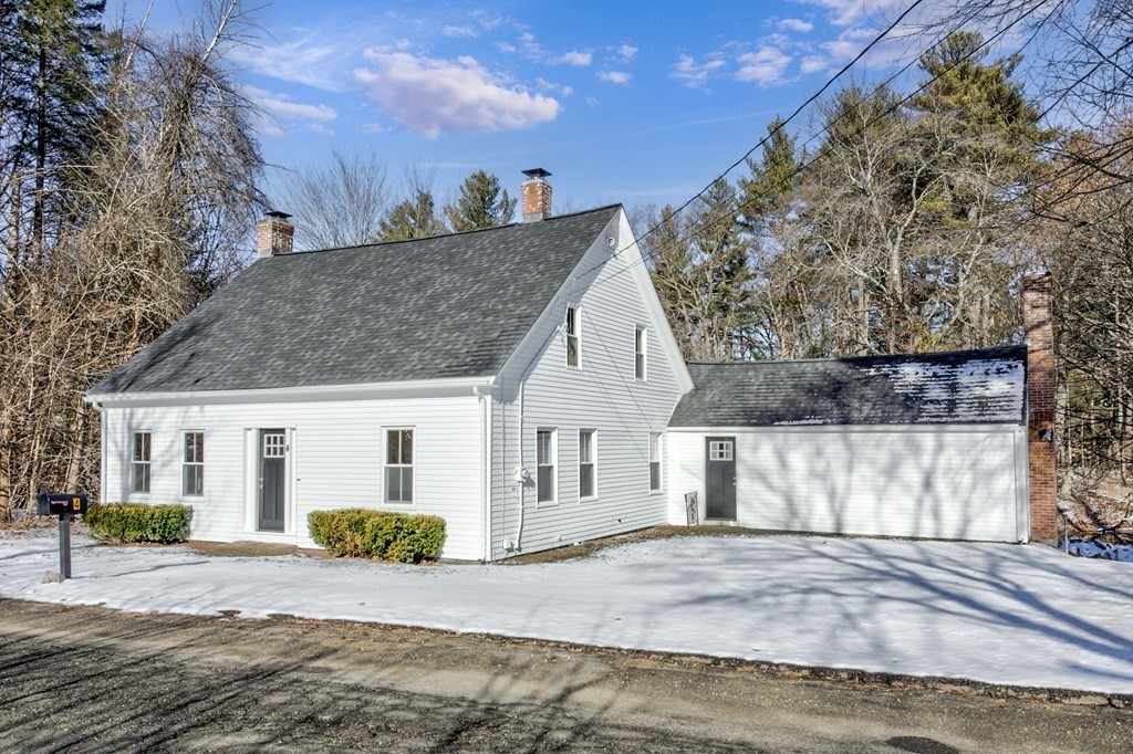 4 Highland Street Townsend, MA 01469 - Photo 2 of 14 a view of a house with a snow in the background