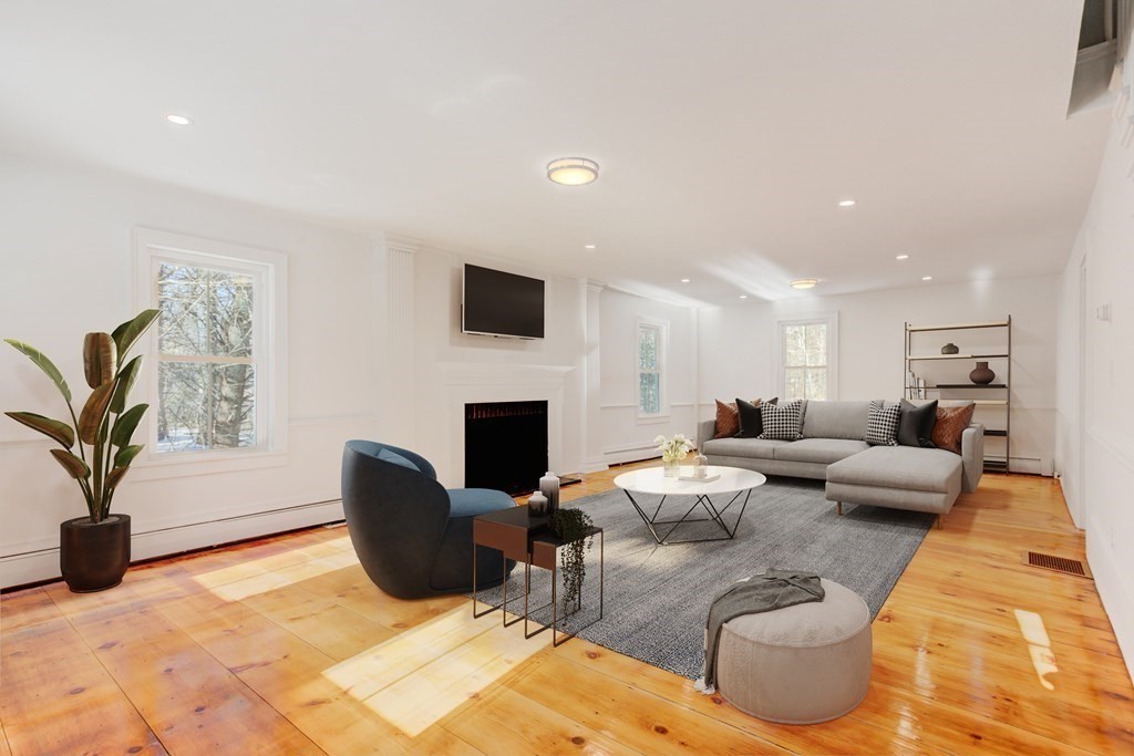 4 Highland Street Townsend, MA 01469 - Photo 3 of 14 a living room with furniture a fireplace and a potted plant