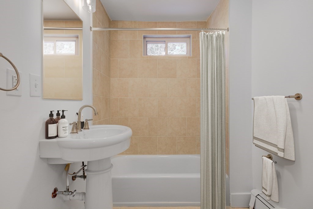 4 Highland Street Townsend, MA 01469 - Photo 7 of 14 a bathroom with a sink a toilet and shower