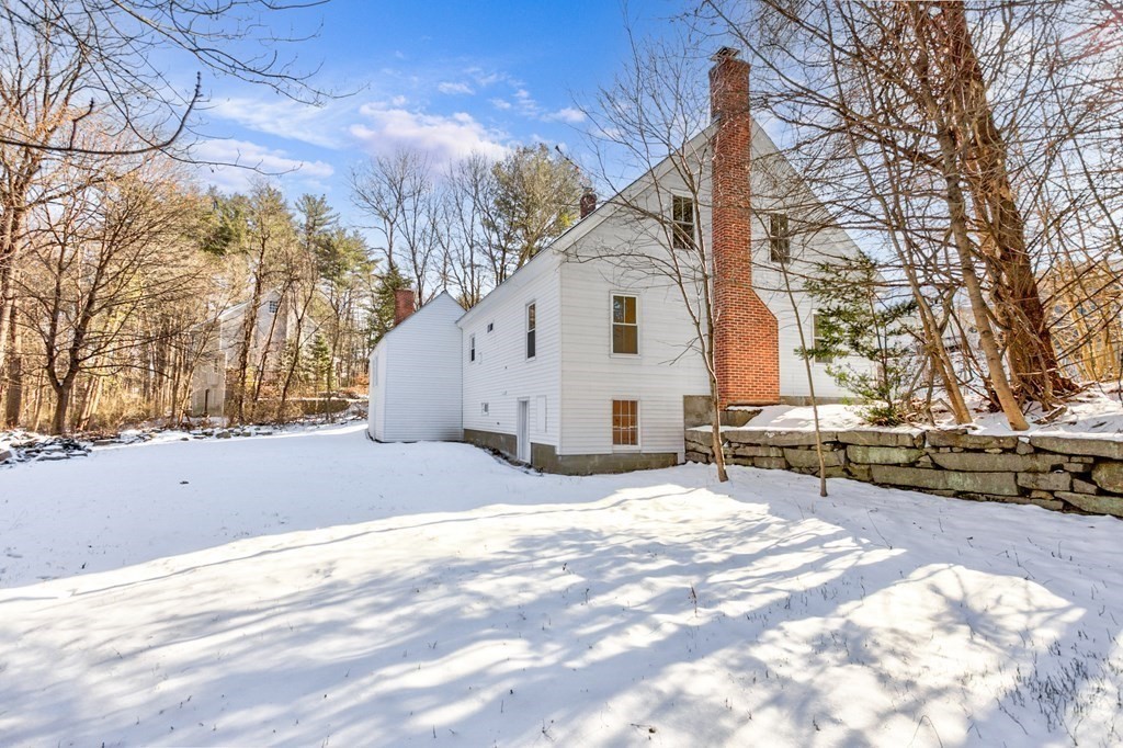 4 Highland Street Townsend, MA 01469 - Photo 10 of 14 a view of a house with snow on the road