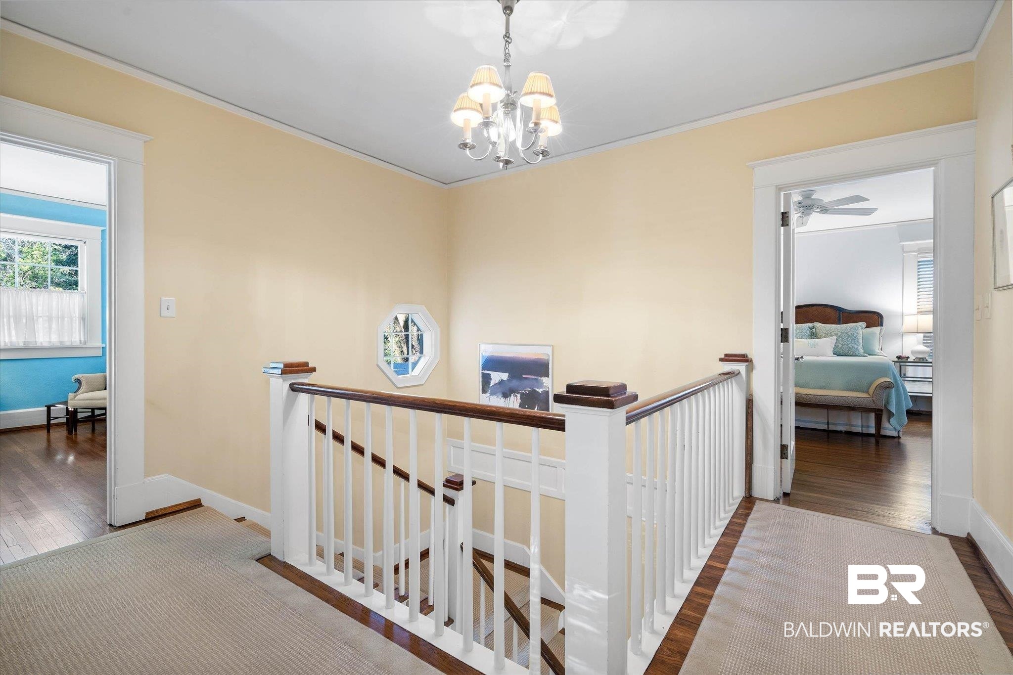 2 Westgate Road Mobile, AL 36608 - Photo 33 of 63 Hall featuring an upstairs landing, crown molding, wood finished floors, and suspended lighting
