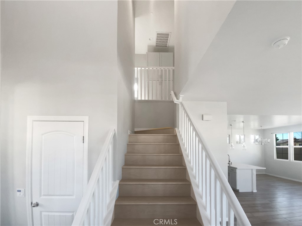 12420 Tesoro Court Grand Terrace, CA 92313 - Photo 20 of 43 a view of staircase with wooden floor and staircase