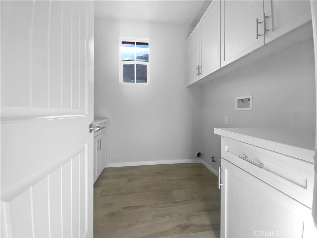 12420 Tesoro Court Grand Terrace, CA 92313 - Photo 23 of 43 a view of storage and utility room with a fireplace