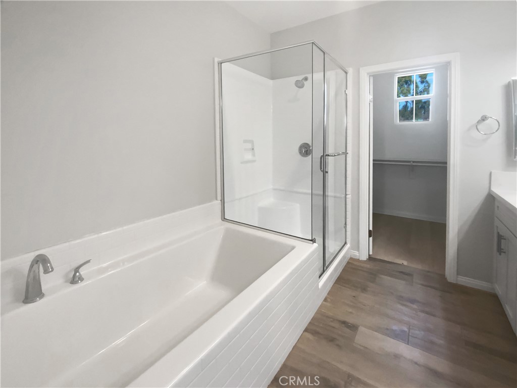12420 Tesoro Court Grand Terrace, CA 92313 - Photo 32 of 43 a bathroom with a bathtub and a shower