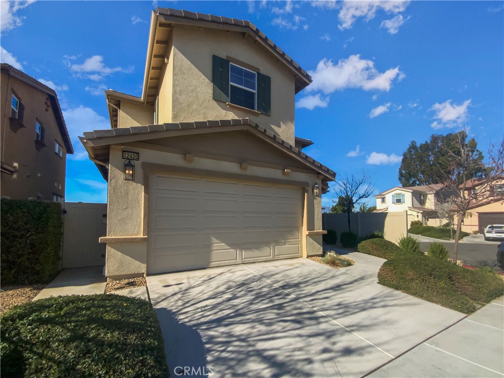 12420 Tesoro Court Grand Terrace, CA 92313 - Photo 38 of 43 a house with a yard
