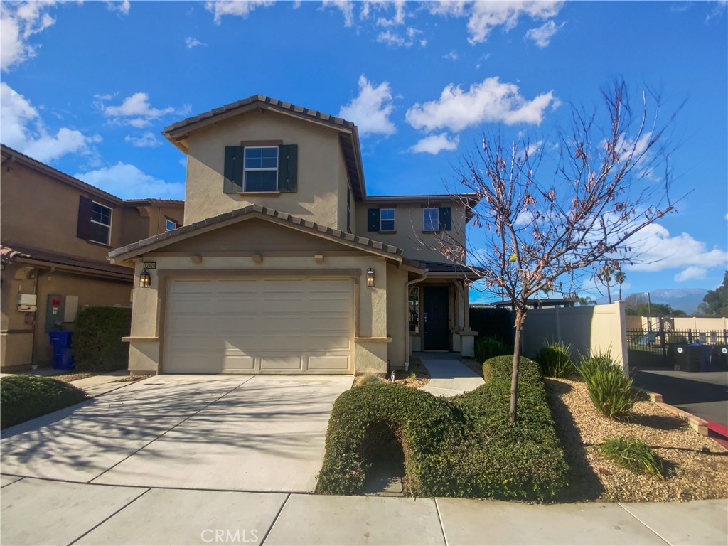 12420 Tesoro Court Grand Terrace, CA 92313 - Photo 39 of 43 a front view of a house with garden