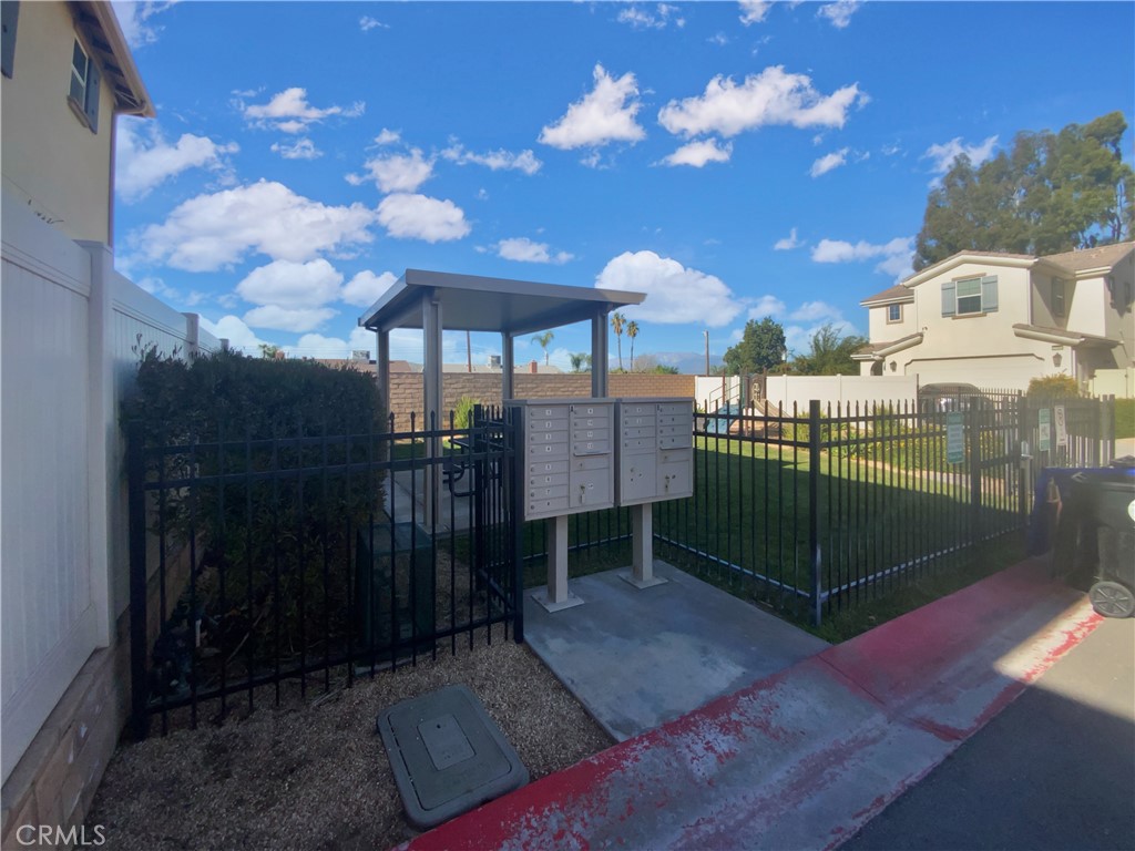 12420 Tesoro Court Grand Terrace, CA 92313 - Photo 42 of 43 a view of a porch with a table and chairs