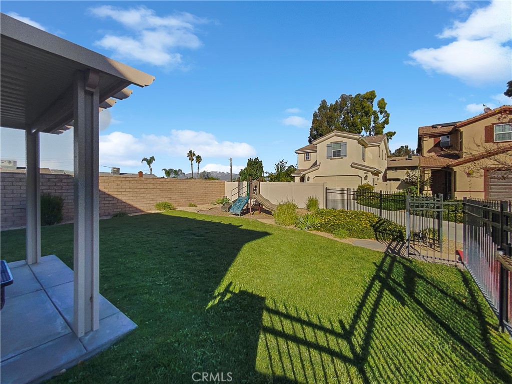 12420 Tesoro Court Grand Terrace, CA 92313 - Photo 6 of 43 a view of a swimming pool with a patio