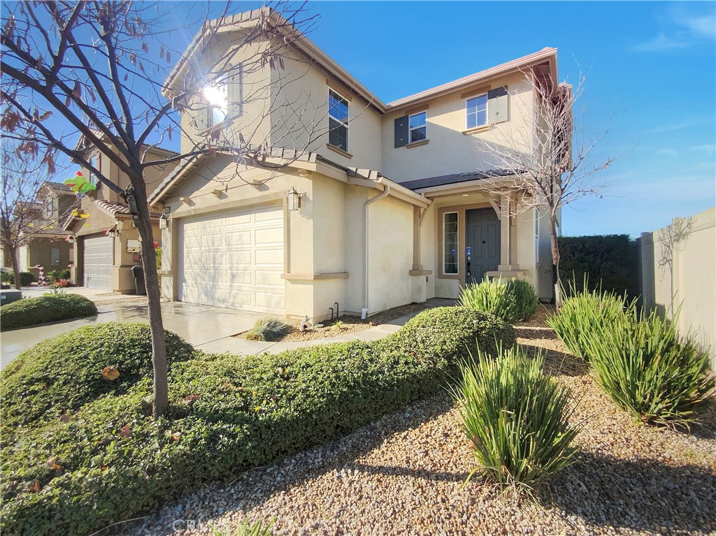 12420 Tesoro Court Grand Terrace, CA 92313 - Photo 8 of 43 a front view of a house with a yard