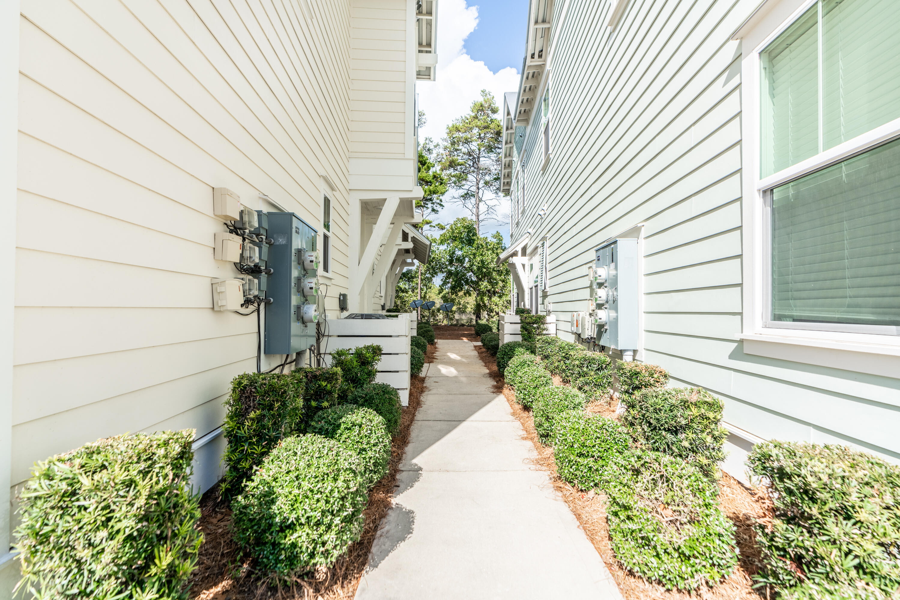 259 Milestone Dr Inlet Beach, Unit B Inlet Beach, FL 32461 - Photo 2 of 48 a view of a pathway with house in front of main door