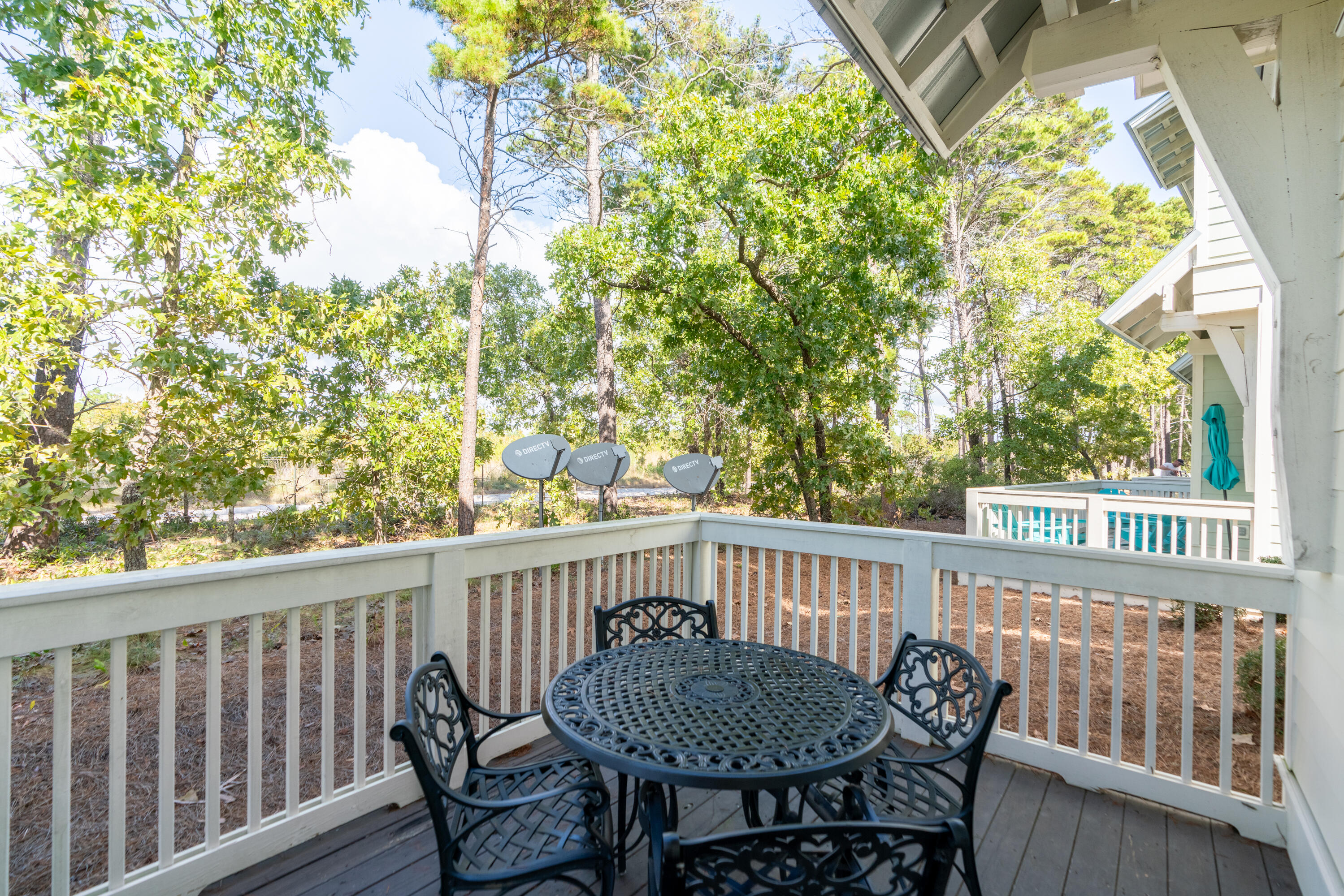 259 Milestone Dr Inlet Beach, Unit B Inlet Beach, FL 32461 - Photo 33 of 48 a view of a chair and table in the balcony