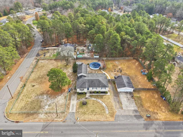a view of a swimming pool with a yard