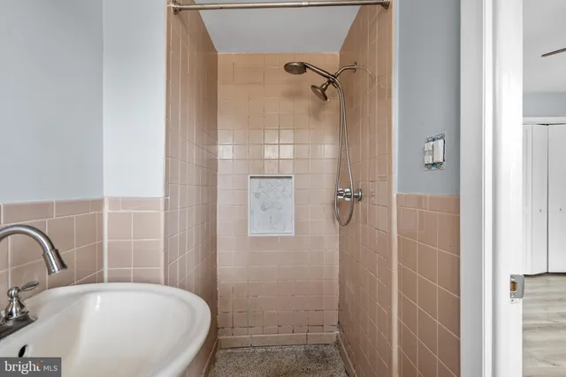 a bathroom with a sink and shower