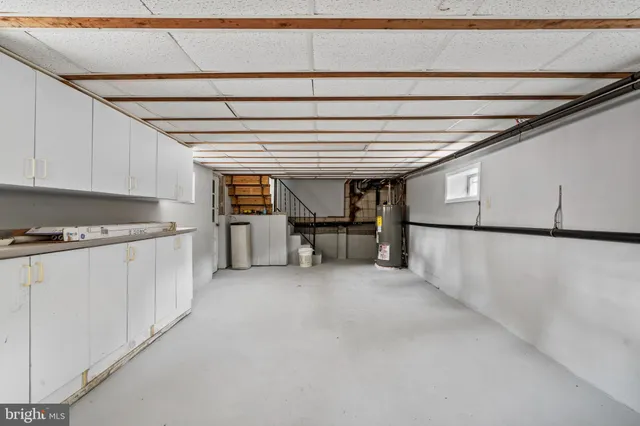 a view of a kitchen with furniture and a kitchen