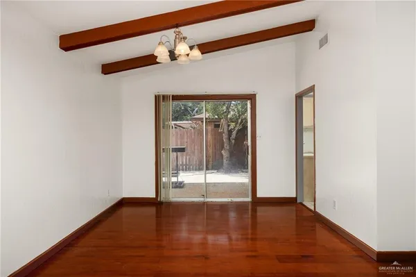 a view of an entryway with wooden floor