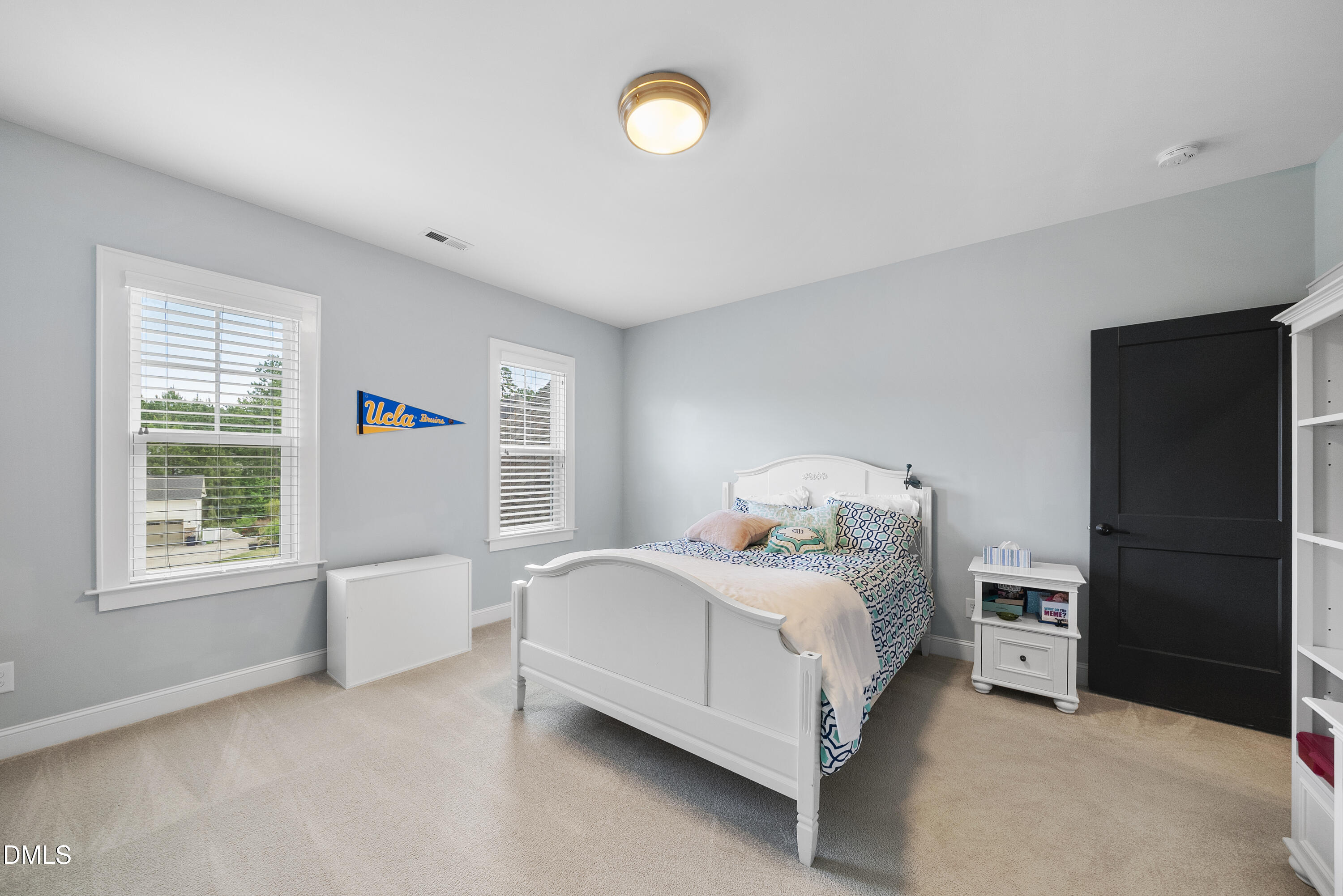 5109 Wainscott Way Raleigh, NC 27612 - Photo 29 of 52 a bedroom with a bed and a window