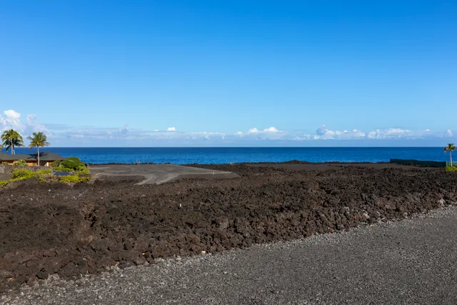 a view of an ocean beach and mountain