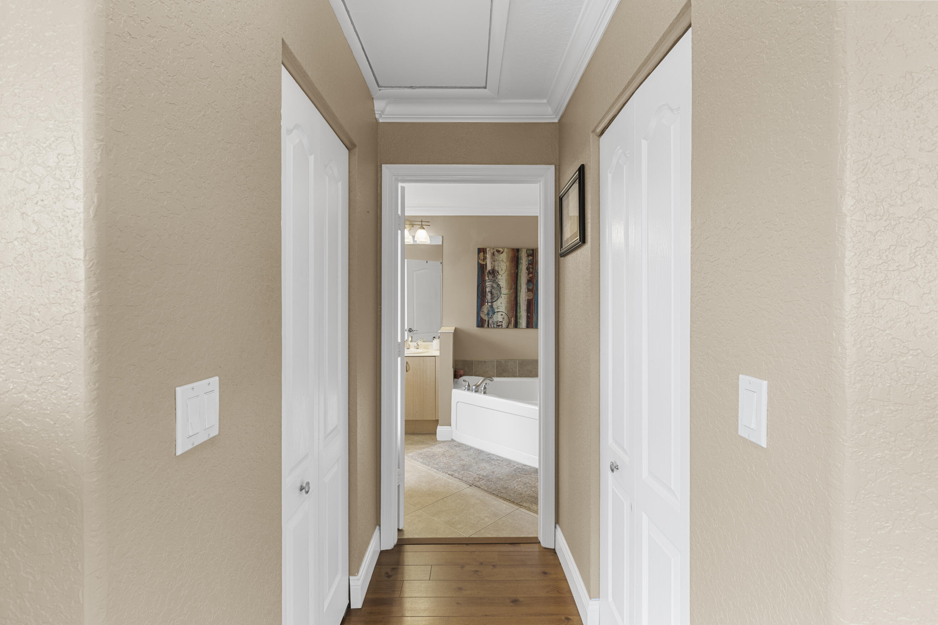 5791 Raceway Road Lake Worth, FL 33449 - Photo 24 of 62 a view of a bathroom from a hallway