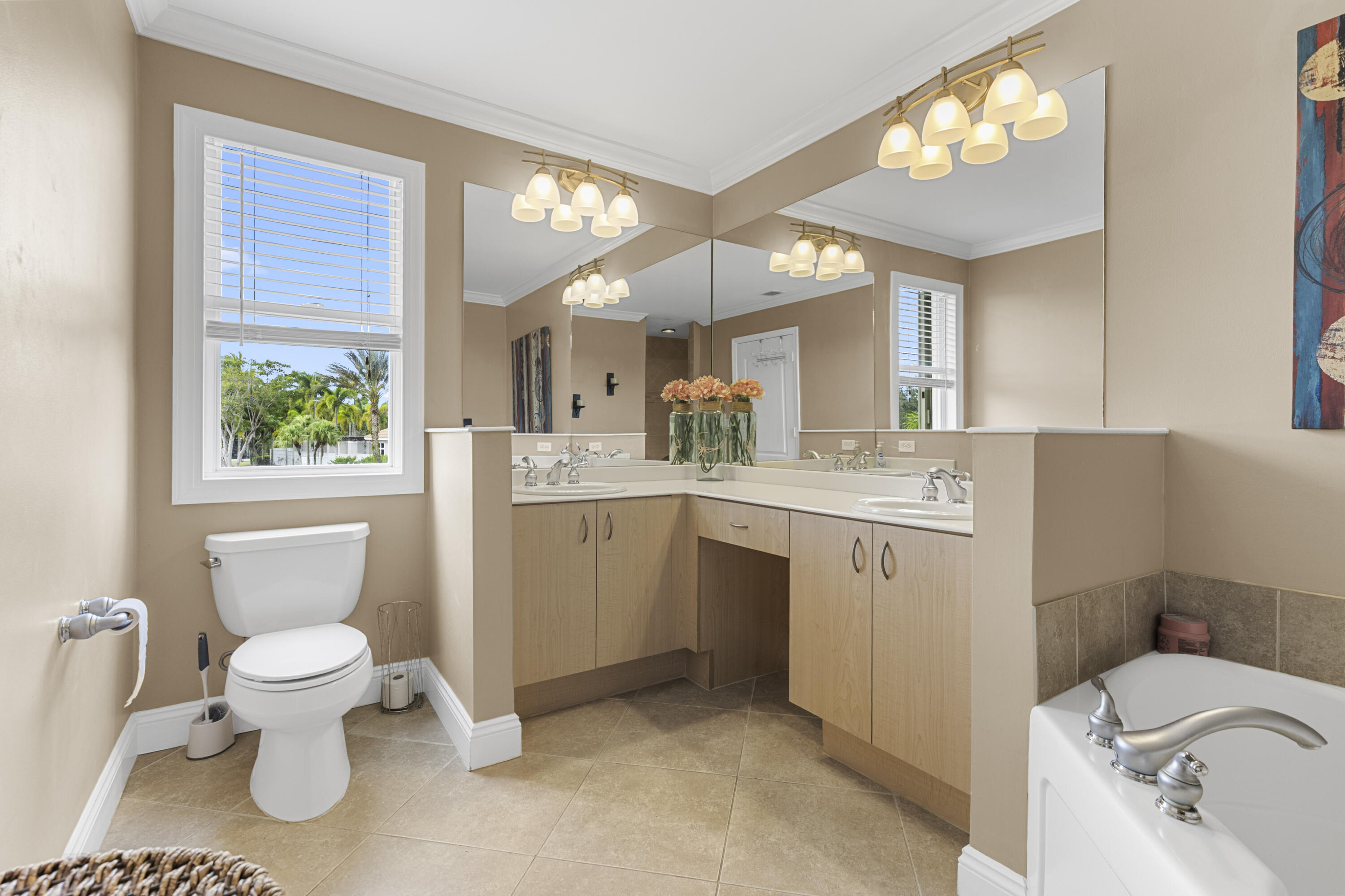 5791 Raceway Road Lake Worth, FL 33449 - Photo 25 of 62 a bathroom with a toilet sink and mirror