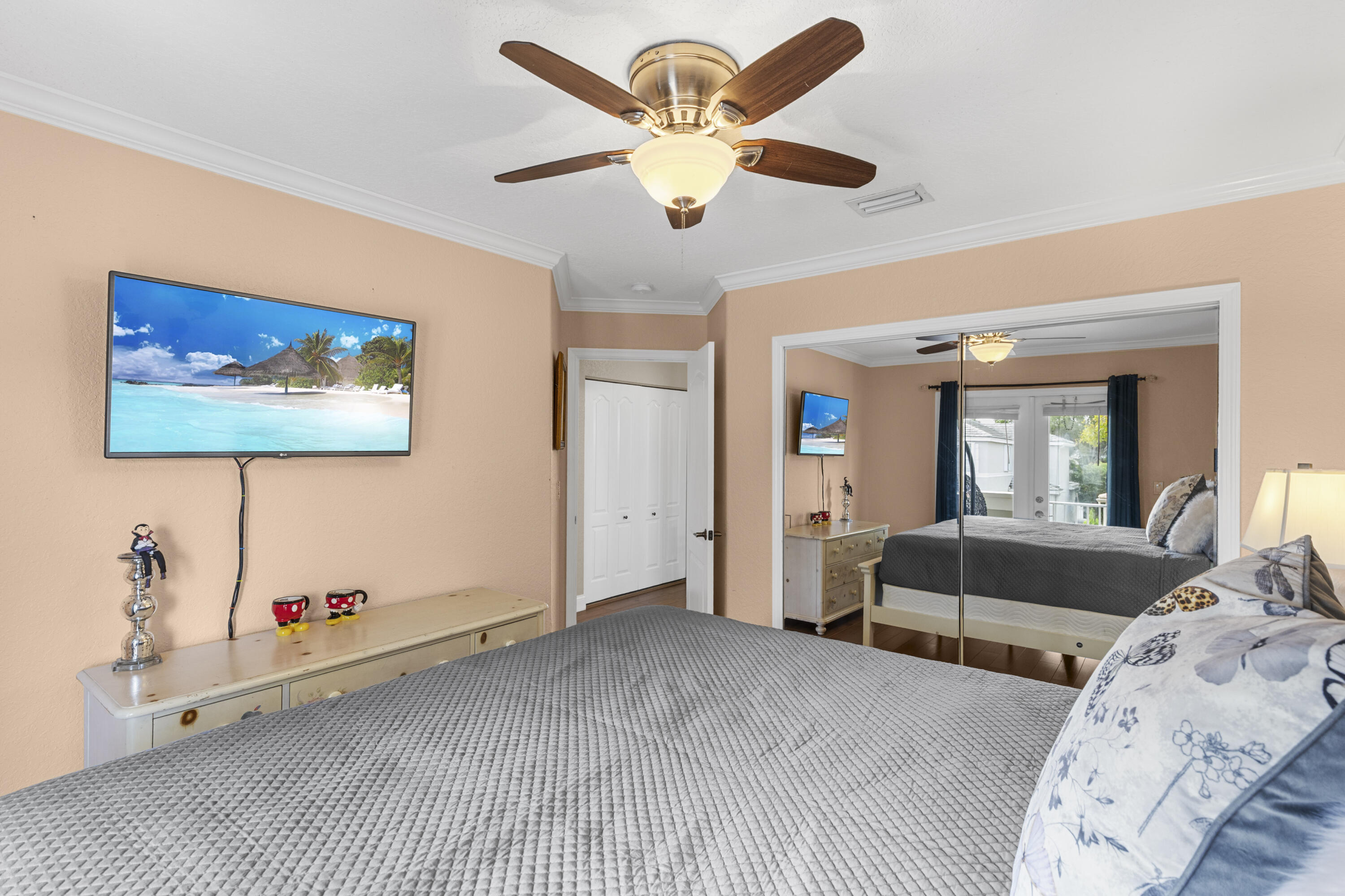 5791 Raceway Road Lake Worth, FL 33449 - Photo 31 of 62 a bedroom with furniture and a large window