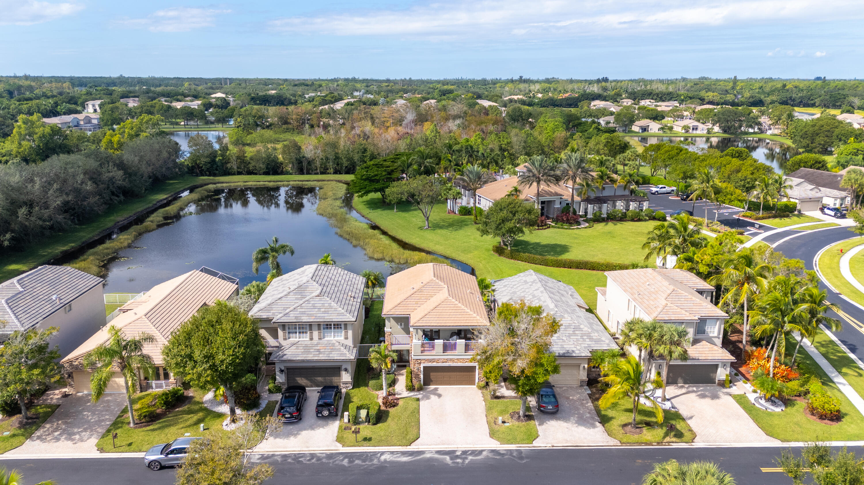 5791 Raceway Road Lake Worth, FL 33449 - Photo 44 of 62 an aerial view of residential house with outdoor space and lake view