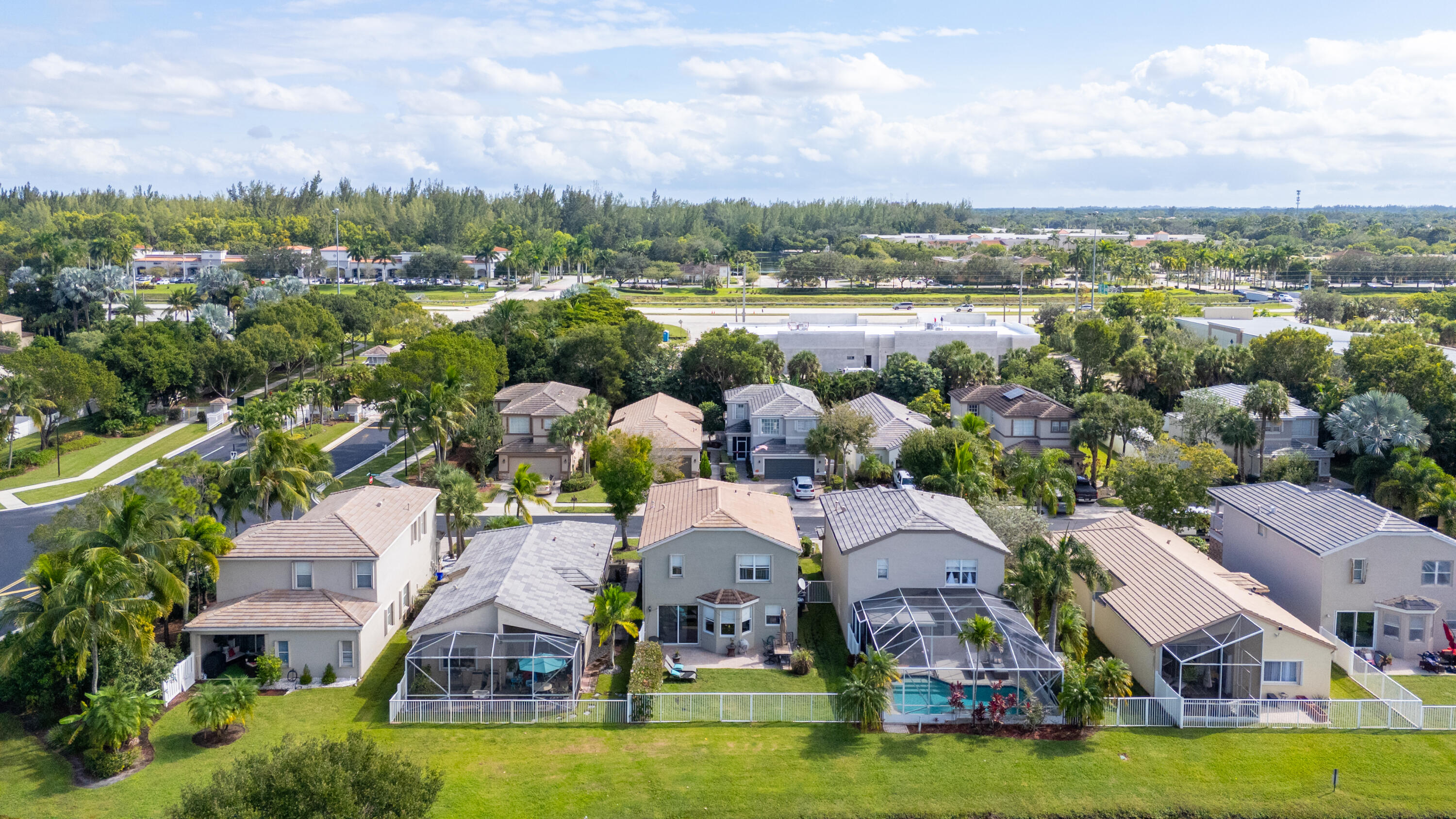 5791 Raceway Road Lake Worth, FL 33449 - Photo 47 of 62 an aerial view of residential houses with outdoor space and lake view