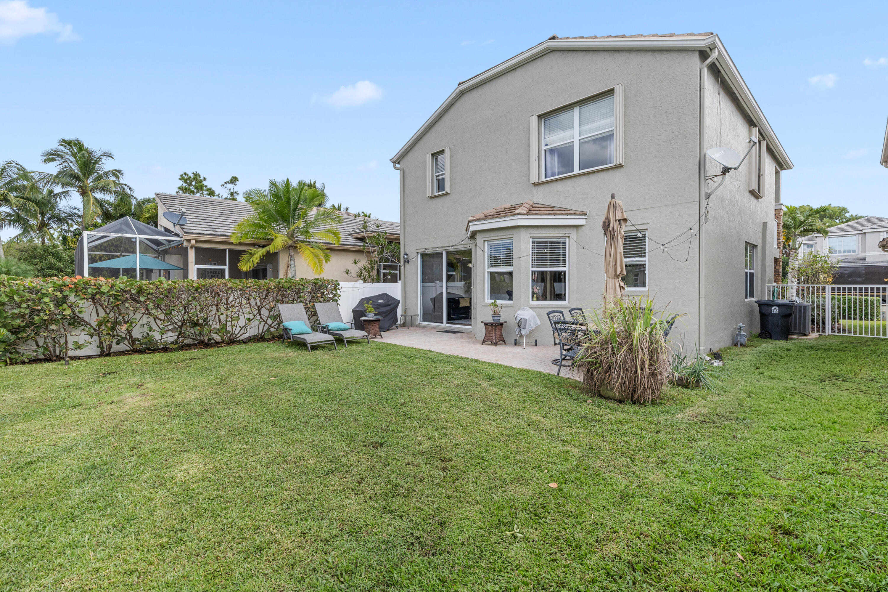 5791 Raceway Road Lake Worth, FL 33449 - Photo 50 of 62 a front view of house with yard and outdoor seating