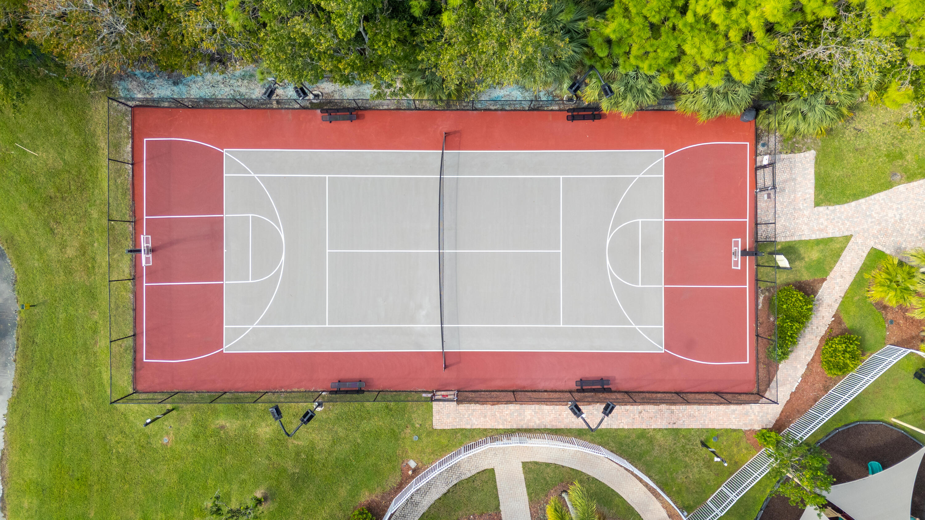 5791 Raceway Road Lake Worth, FL 33449 - Photo 57 of 62 an outdoor space with pool and red umbrella