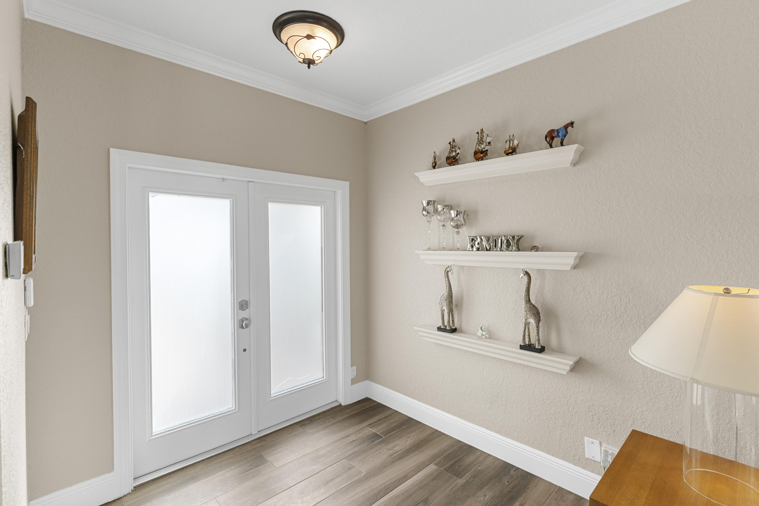 5791 Raceway Road Lake Worth, FL 33449 - Photo 6 of 62 a view of storage and utility room with wooden floor