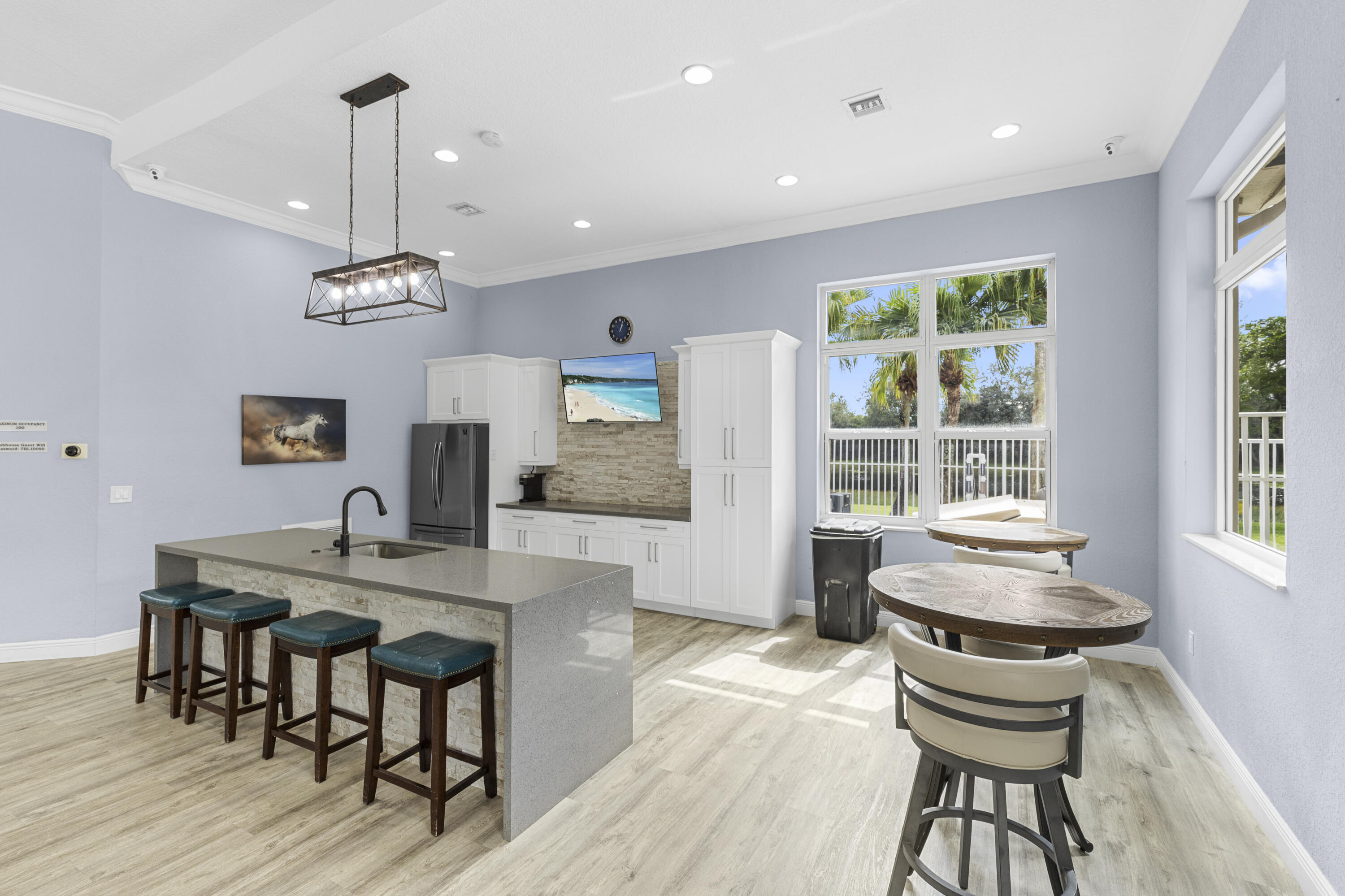 5791 Raceway Road Lake Worth, FL 33449 - Photo 61 of 62 a view of a dining room with furniture window and wooden floor