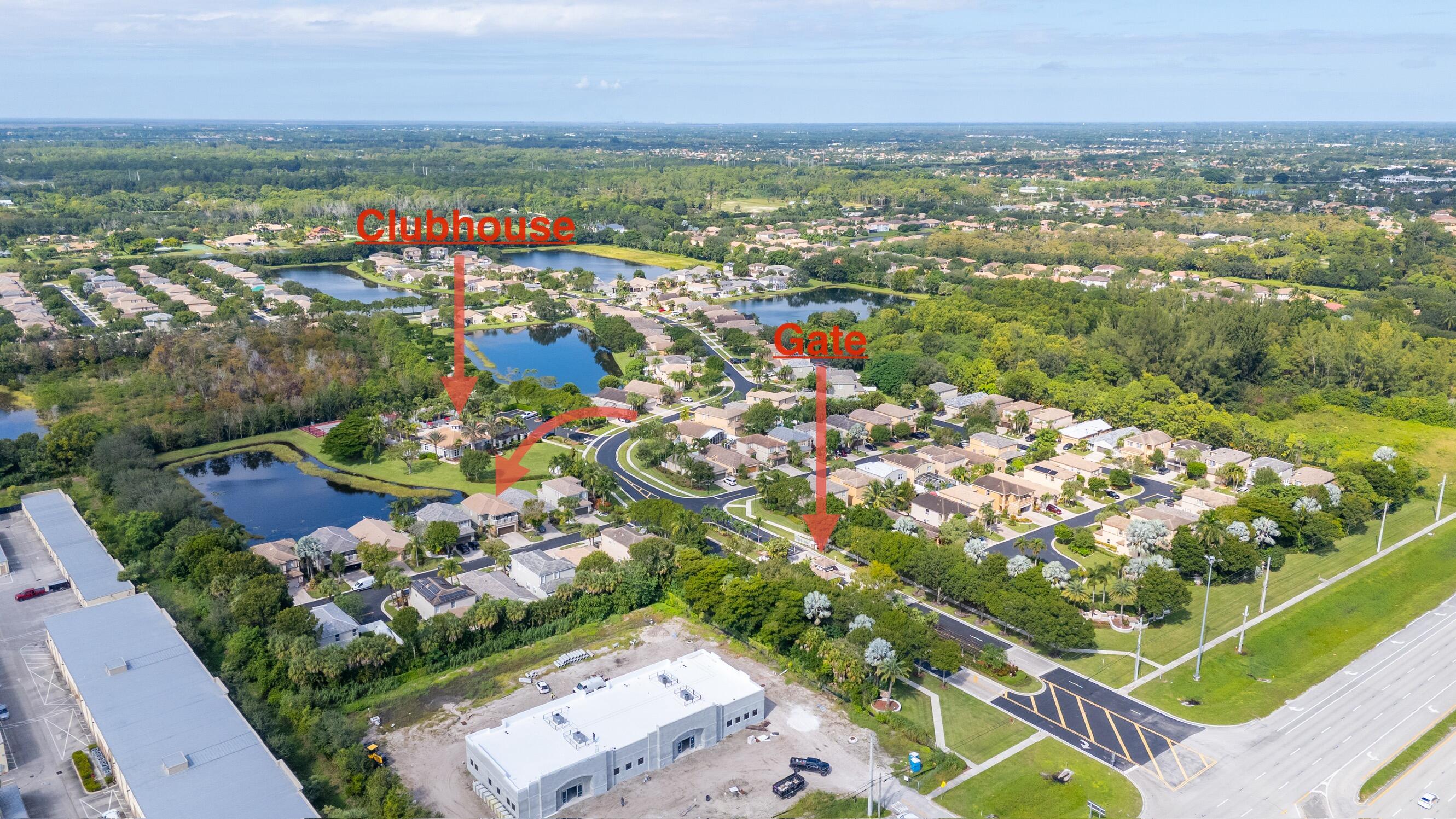 5791 Raceway Road Lake Worth, FL 33449 - Photo 62 of 62 an aerial view of city and lake