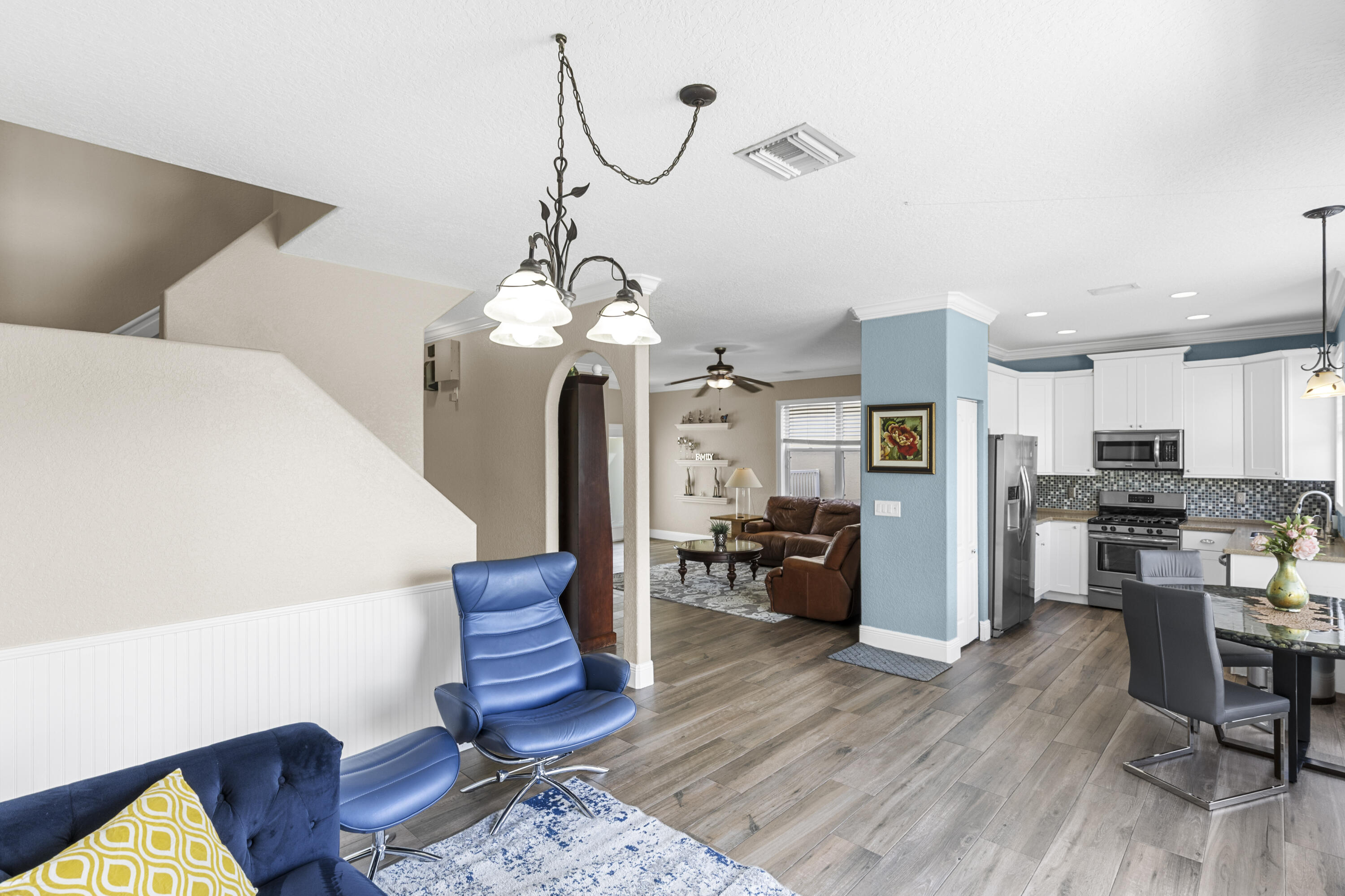 5791 Raceway Road Lake Worth, FL 33449 - Photo 10 of 62 a living room with furniture and kitchen view