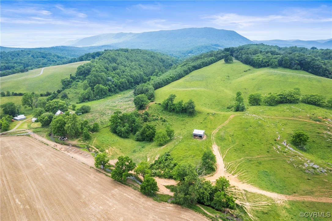 504 Springbranch Road Lexington, VA 24450 - Photo 14 of 50 a view of a lush green hillside and a houses