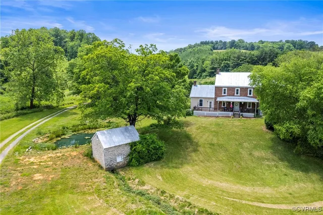 a aerial view of a house with a big yard