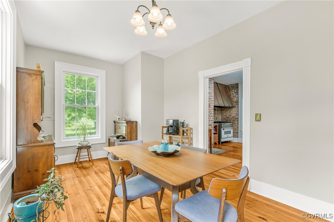 504 Springbranch Road Lexington, VA 24450 - Photo 21 of 50 a dining room with wooden floor and large windows