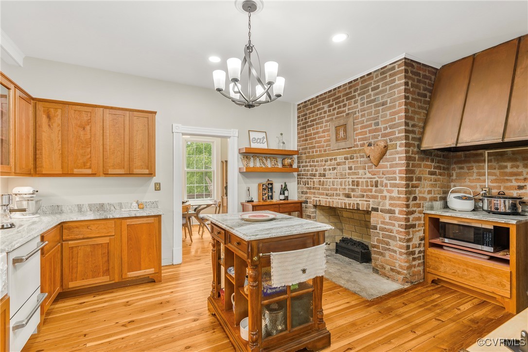 504 Springbranch Road Lexington, VA 24450 - Photo 26 of 50 a kitchen with stainless steel appliances granite countertop a stove top oven a sink dishwasher with a dining table and chairs