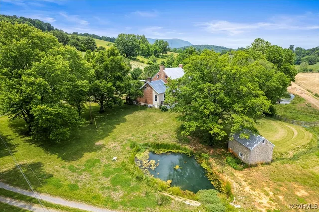 a view of a yard with swimming pool