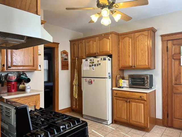 a kitchen with stainless steel appliances a refrigerator a stove a sink and a cabinets
