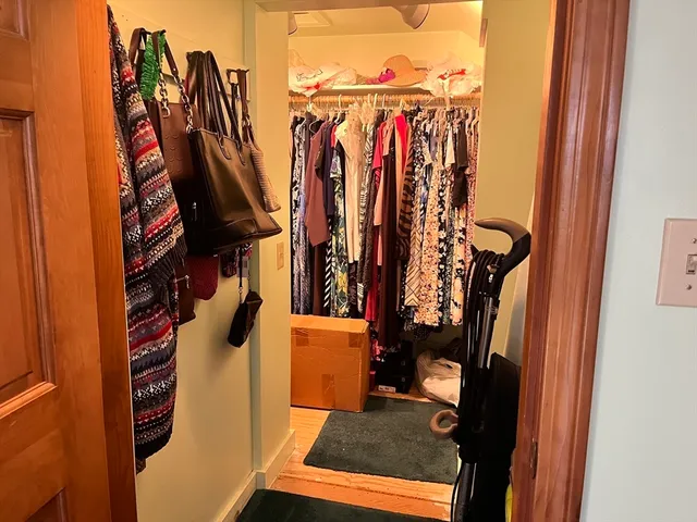 a bathroom with a toilet and a shower curtain