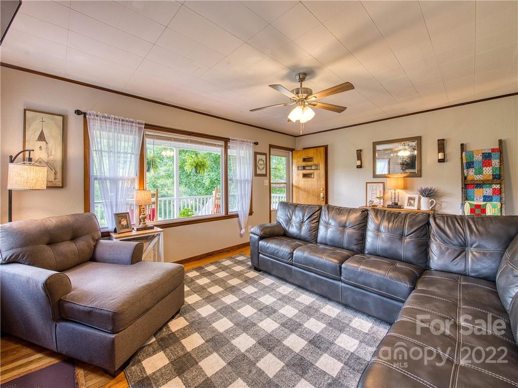 1239 Beaverdam Road Canton, NC 28716 - Photo 11 of 30 a living room with furniture and a large window