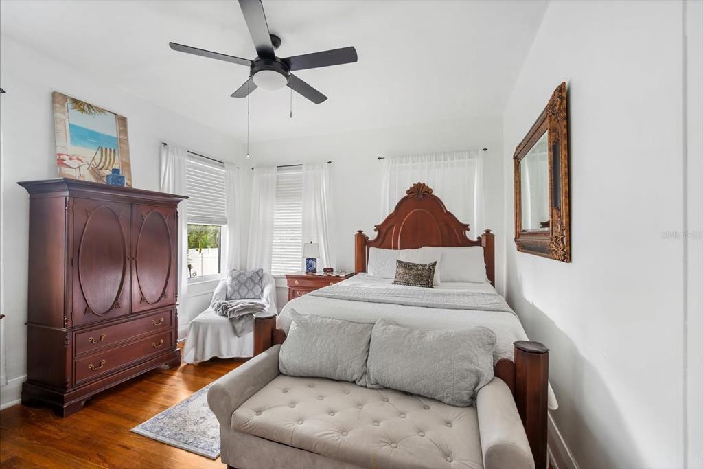 2402 North Ridgewood Avenue Tampa, FL 33602 - Photo 18 of 56 a bedroom with a bed dresser and wooden floor