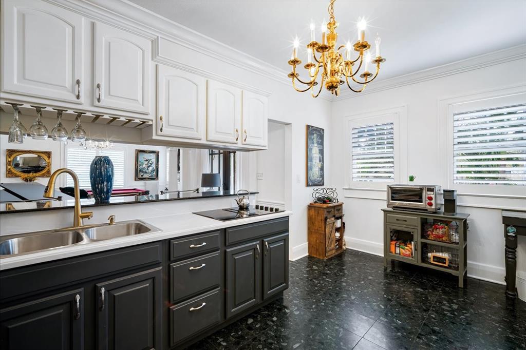 2402 North Ridgewood Avenue Tampa, FL 33602 - Photo 24 of 56 a kitchen with stainless steel appliances granite countertop a sink stove and cabinets