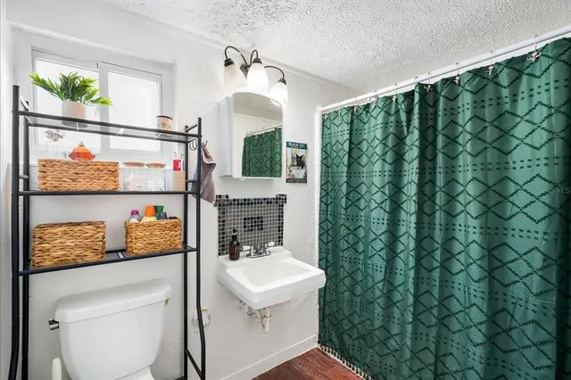 a kitchen with a refrigerator and a stove