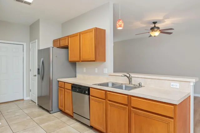 a kitchen with a sink and cabinets