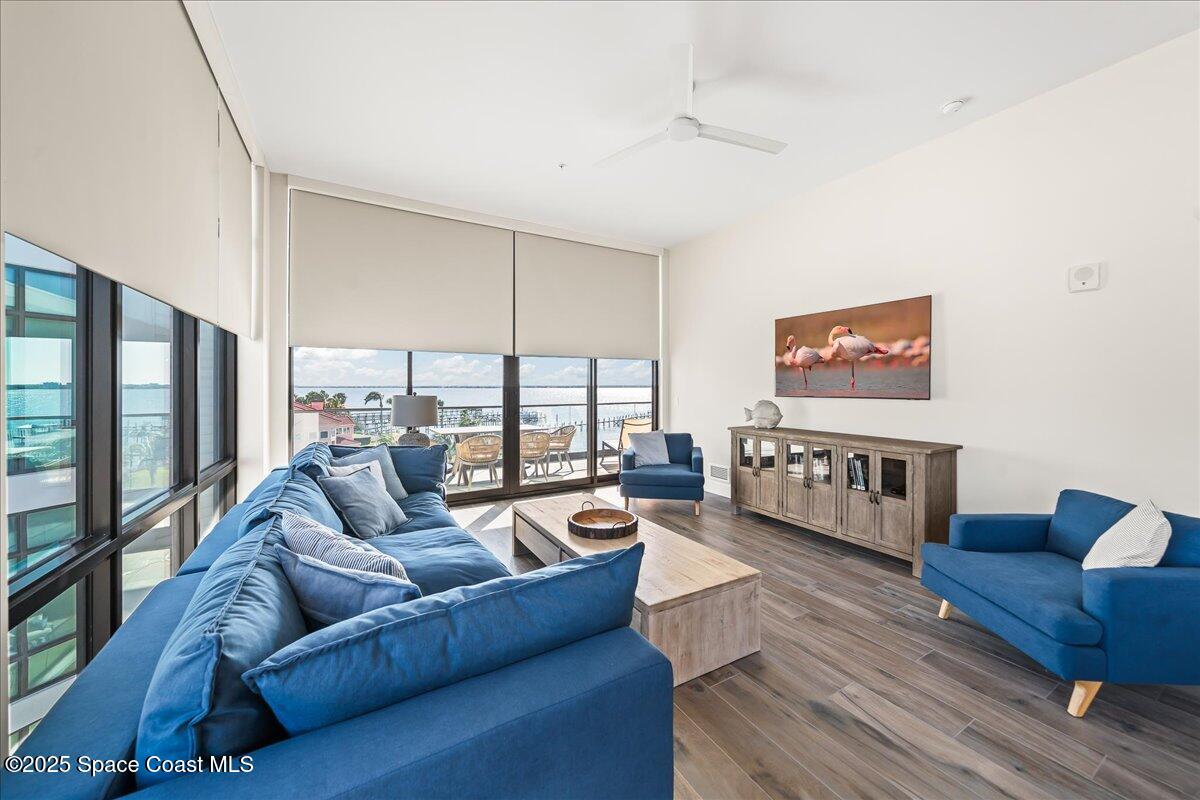 225 Strand Drive, Unit 401 Melbourne Beach, FL 32951 - Photo 15 of 51 a living room with furniture and a large window