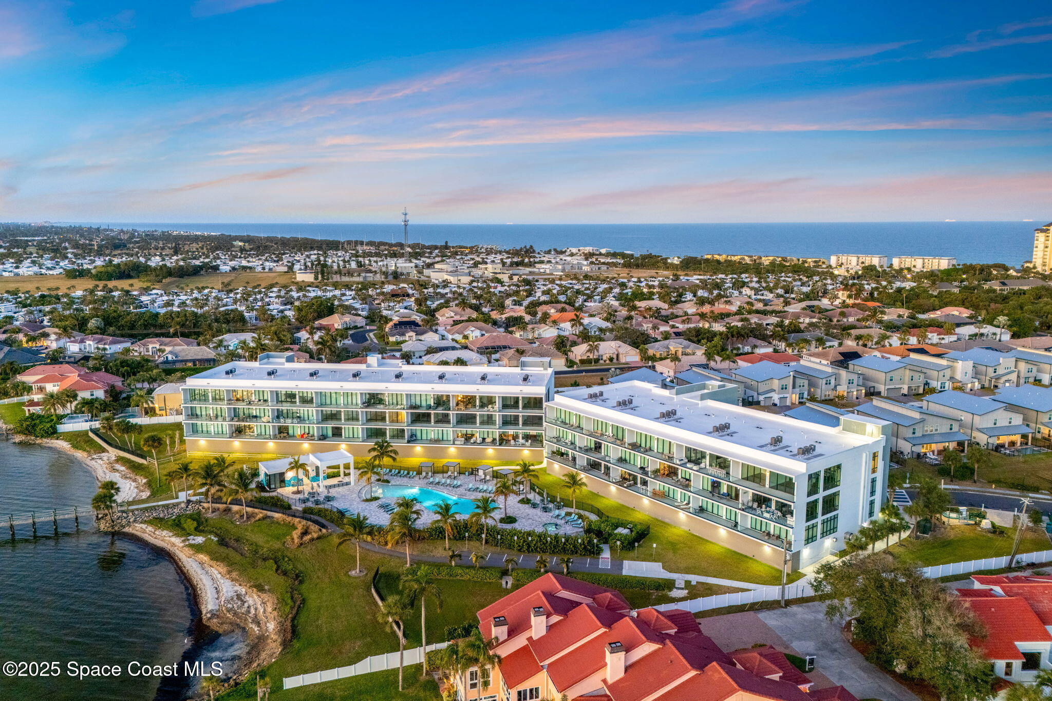 225 Strand Drive, Unit 401 Melbourne Beach, FL 32951 - Photo 2 of 51 a view of a city with an ocean