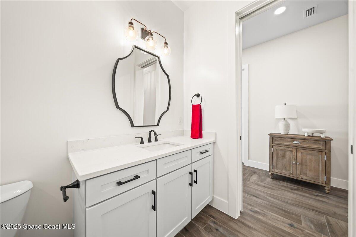 225 Strand Drive, Unit 401 Melbourne Beach, FL 32951 - Photo 27 of 51 a bathroom with a sink and a mirror